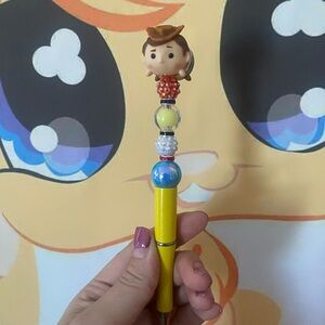 Yellow Toy Story Pen with Woody Figure